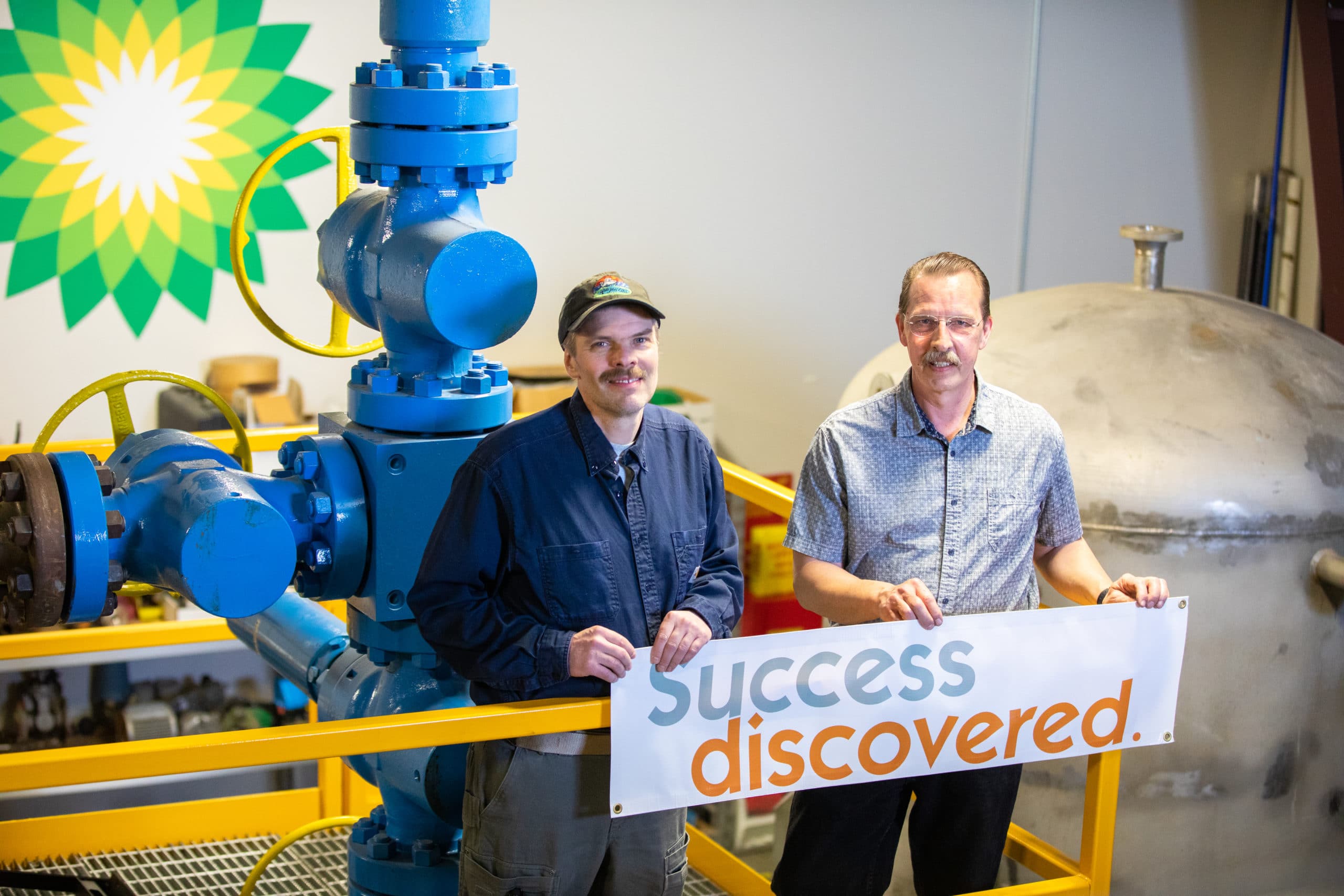 Process technology program alumnus Matt Varga, left, and associate professor and program coordinator Brian Ellingson visit the program’s facility in April 2022.